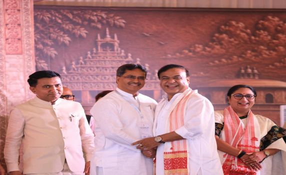 Tripura CM Dr Manik Saha greets Himanta Biswa Sarma after oath taking as Assam CM